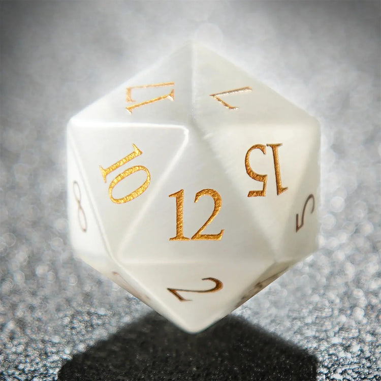White Jade Pirate D12 die with golden numerals, showcasing intricate craftsmanship and shimmering design.