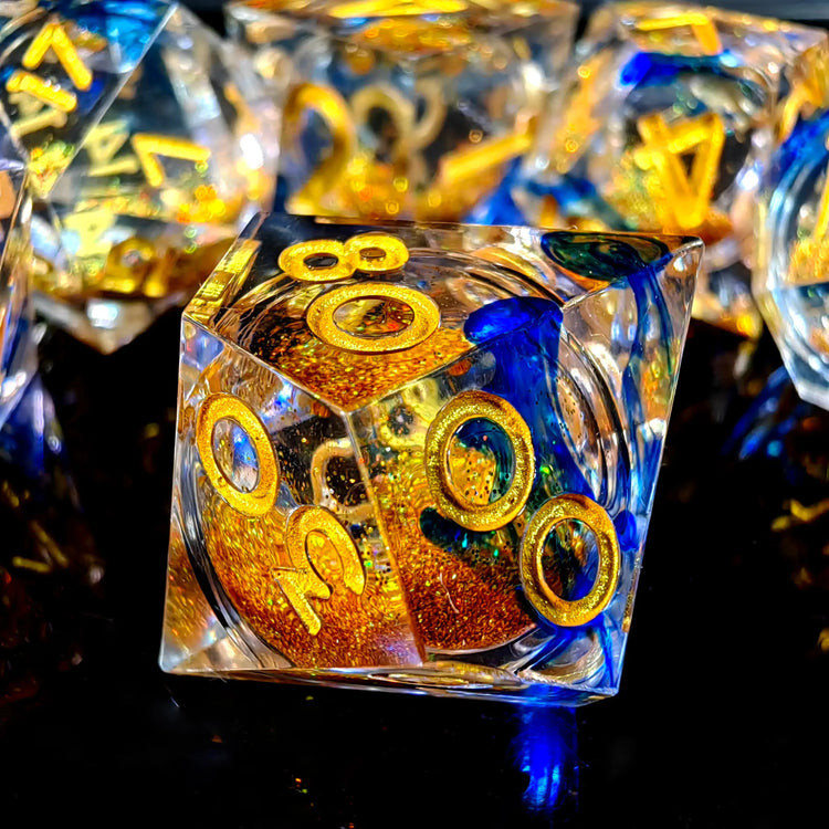 7-Piece Sharp Edge Resin Dice Set – Transparent Polyhedral Dice with Golden Sand & Gold Lettering for D&D & RPG Games Gamers Guild